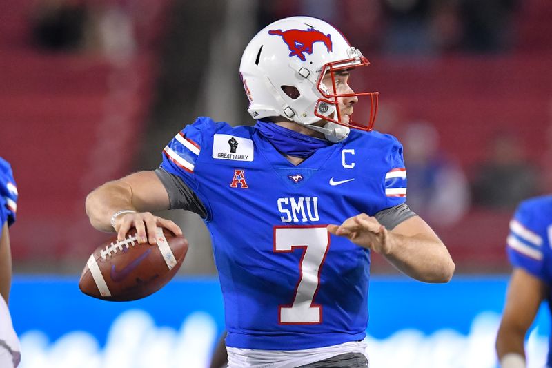 Oct 31, 2020; Dallas, Texas, USA; Southern Methodist Mustangs quarterback Shane Buechele (7) looks down field against Navy Midshipmen during the first half at Gerald J. Ford Stadium. Mandatory Credit: Tim Flores-USA TODAY Sports