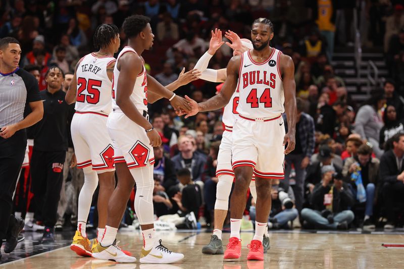 CHICAGO, ILLINOIS - DECEMBER 20: Patrick Williams #44 of the Chicago Bulls high fives Terry Taylor #32 against the Los Angeles Lakers during the second half at the United Center on December 20, 2023 in Chicago, Illinois. NOTE TO USER: User expressly acknowledges and agrees that, by downloading and or using this photograph, User is consenting to the terms and conditions of the Getty Images License Agreement.  (Photo by Michael Reaves/Getty Images)