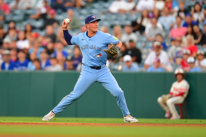 Aug 12, 2024; Anaheim, California, USA; Toronto Blue Jays second baseman Will Wagner (7) throws to first for the out against Los Angeles Angels designated hitter Willie Calhoun (5) during the second inning at Angel Stadium. Mandatory Credit: Gary A. Vasquez-USA TODAY Sports