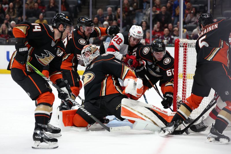 Mar 1, 2024; Anaheim, California, USA; Anaheim Ducks goaltender Lukas Dostal (1) protects the goal during the third period against the New Jersey Devils at Honda Center. Mandatory Credit: Kiyoshi Mio-USA TODAY Sports