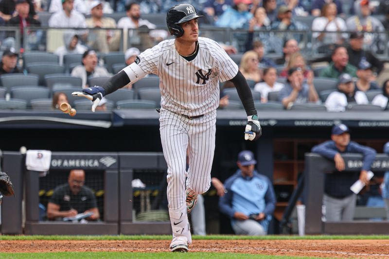 May 4, 2025; Bronx, New York, USA; New York Yankees left fielder Cody Bellinger (35) hits a two run home run during the sixth inning against the Tampa Bay Rays at Yankee Stadium. Mandatory Credit: Vincent Carchietta-Imagn Images