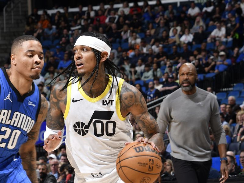 ORLANDO, FL - FEBRUARY 29: Jordan Clarkson #00 of the Utah Jazz handles the ball during the game against the Orlando Magic on February 29, 2024 at Amway Center in Orlando, Florida. NOTE TO USER: User expressly acknowledges and agrees that, by downloading and or using this photograph, User is consenting to the terms and conditions of the Getty Images License Agreement. Mandatory Copyright Notice: Copyright 2024 NBAE (Photo by Fernando Medina/NBAE via Getty Images)