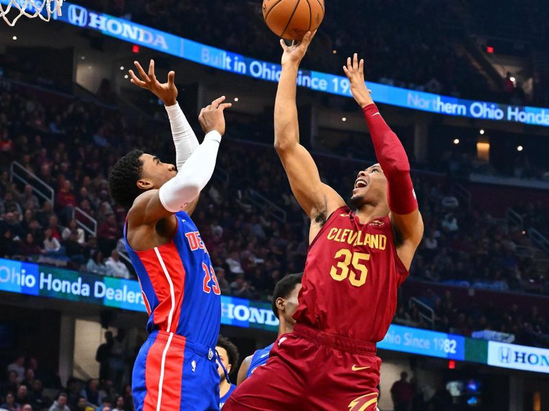 CLEVELAND, OHIO - JANUARY 31: Isaac Okoro #35 of the Cleveland Cavaliers shoots over Jaden Ivey #23 of the Detroit Pistons during the first half at Rocket Mortgage Fieldhouse on January 31, 2024 in Cleveland, Ohio. (Photo by Jason Miller/Getty Images) NOTE TO USER: User expressly acknowledges and agrees that, by downloading and or using this photograph, User is consenting to the terms and conditions of the Getty Images License Agreement. (Photo by Jason Miller/Getty Images)