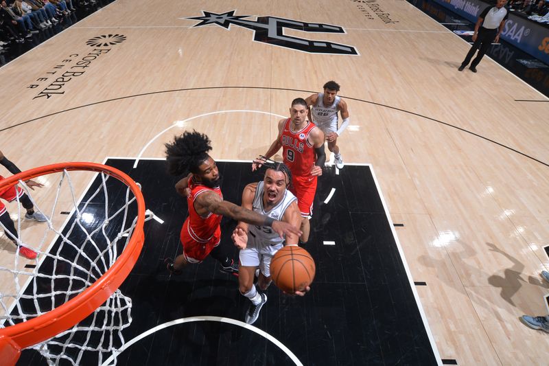 SAN ANTONIO, TX - JANUARY 13: Tre Jones #33 of the San Antonio Spurs drives to the basket during the game against the Chicago Bulls on January 13, 2024 at the Frost Bank Center in San Antonio, Texas. NOTE TO USER: User expressly acknowledges and agrees that, by downloading and or using this photograph, user is consenting to the terms and conditions of the Getty Images License Agreement. Mandatory Copyright Notice: Copyright 2024 NBAE (Photos by Michael Gonzales/NBAE via Getty Images)