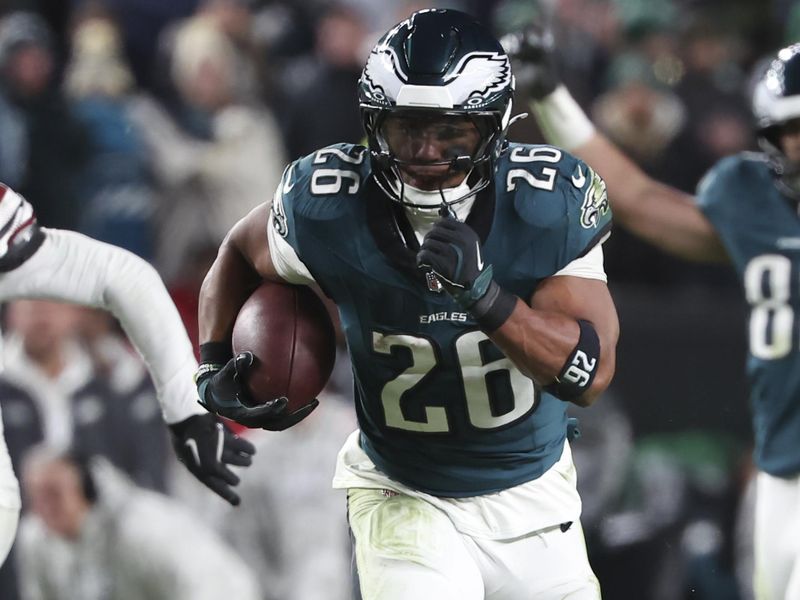 Philadelphia Eagles running back Saquon Barkley (26) breaks free for a rushing touchdown during an NFL football game against the Washington Commanders, Thursday, Nov. 14, 2024, in Philadelphia, PA. (AP Photo/Peter Joneleit)