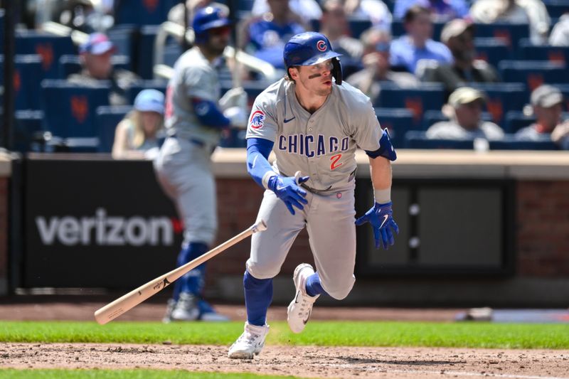 May 2, 2024; New York City, New York, USA; Chicago Cubs second baseman Nico Hoerner (2) hits a single against the New York Mets during the fifth inning at Citi Field. Mandatory Credit: John Jones-USA TODAY Sports