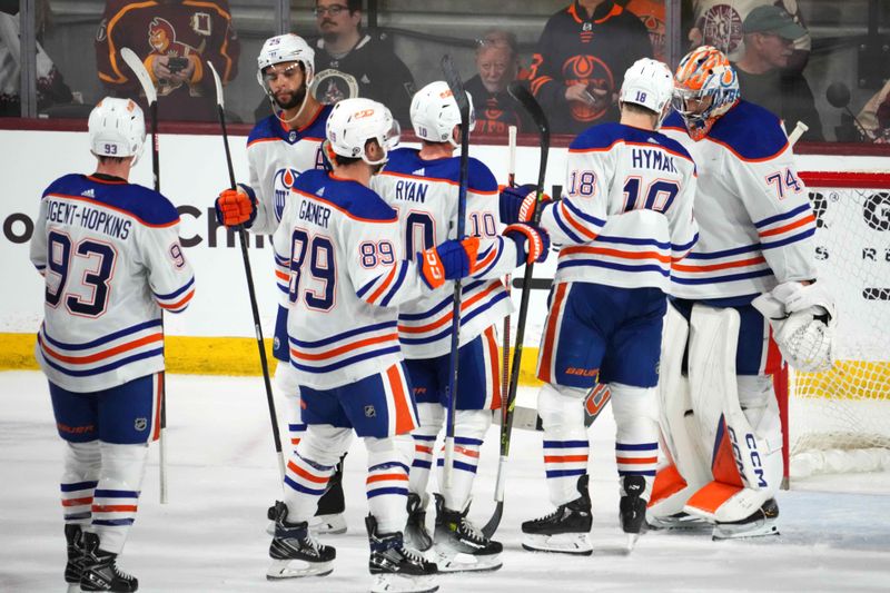 Feb 19, 2024; Tempe, Arizona, USA; Edmonton Oilers players celebrate after defeating the Arizona Coyotes during the third period at Mullett Arena. Mandatory Credit: Joe Camporeale-USA TODAY Sports