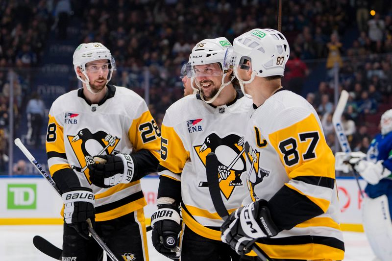 sFeb 27, 2024; Vancouver, British Columbia, CAN; Pittsburgh Penguins defenseman Erik Karlsson (65) and forward Sidney Crosby (87) celebrate a goal scored by forward Rickard Rakell (67) against the Vancouver Canucksn the second period at Rogers Arena. Mandatory Credit: Bob Frid-USA TODAY Sports