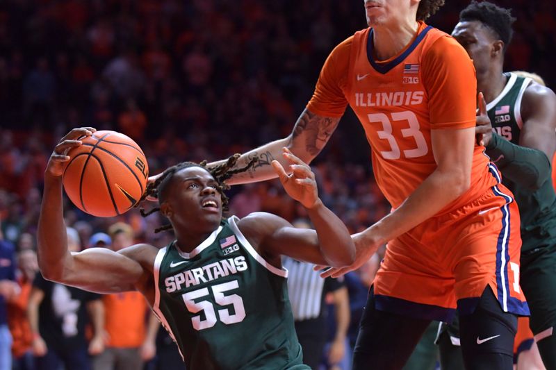 Jan 11, 2024; Champaign, Illinois, USA;  Michigan State Spartans forward Coen Carr (55) grabs a loose ball under the basket as Illinois Fighting Illini forward Coleman Hawkins (33) defends during the second half at State Farm Center. Mandatory Credit: Ron Johnson-USA TODAY Sports