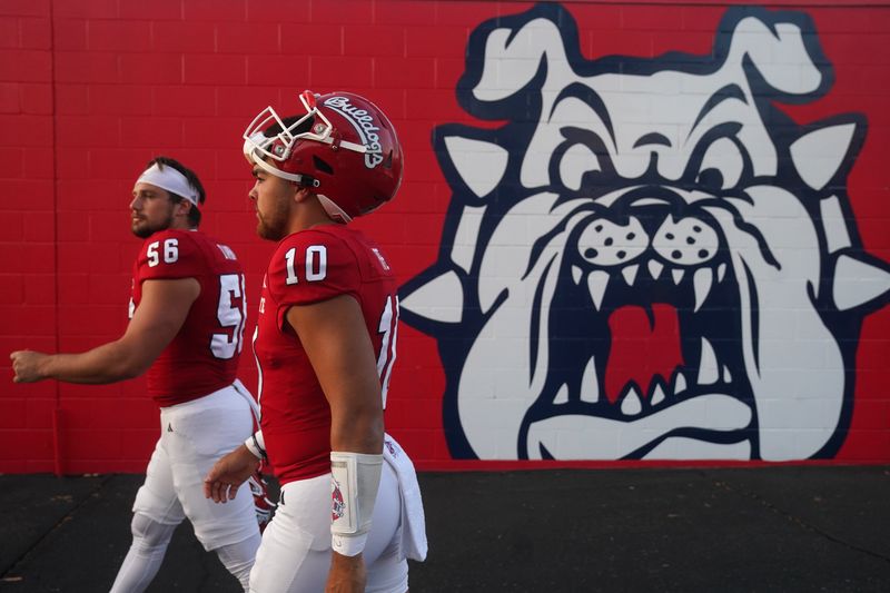 Sep 30, 2023; Fresno, California, USA; Fresno State Bulldogs quarterback Logan Fife (10) walks towards the field next to long snapper Nick D   Ambra (56) before the start of the game against the Nevada Wolf Pack at Valley Children's Stadium. Mandatory Credit: Cary Edmondson-USA TODAY Sports