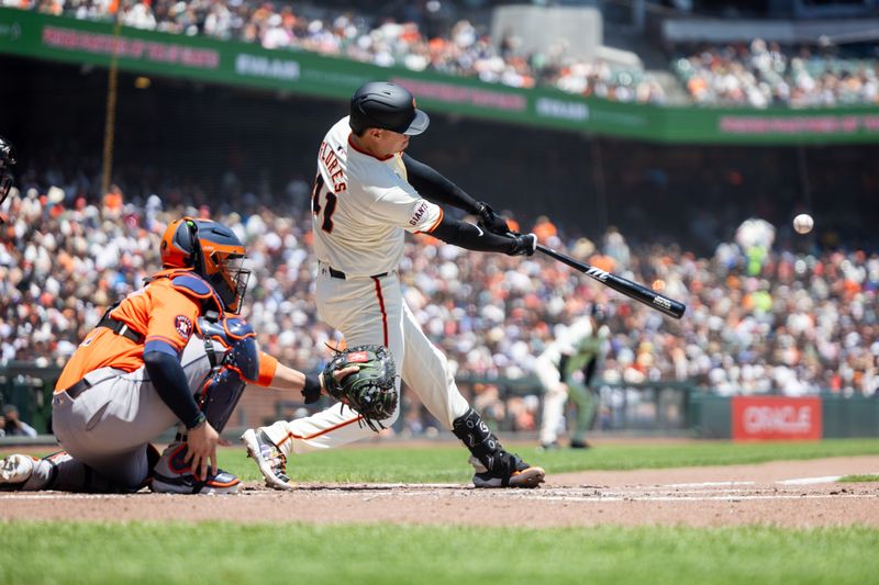 Jun 12, 2024; San Francisco, California, USA;  San Francisco Giants first base Wilmer Flores (41) drives in a run with a broken bat single during the third inning against the Houston Astros at Oracle Park. Mandatory Credit: Bob Kupbens-USA TODAY Sports