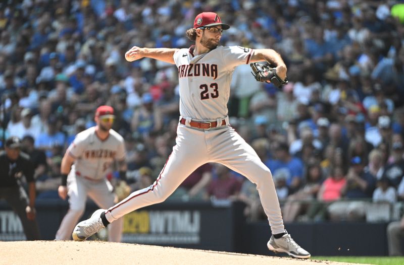 Jun 21, 2023; Milwaukee, Wisconsin, USA; Arizona Diamondbacks starting pitcher Zac Gallen (23) delivers a pitch against the Milwaukee Brewers in the first inning at American Family Field. Mandatory Credit: Michael McLoone-USA TODAY Sports