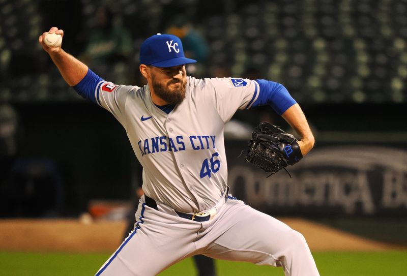 Jun 19, 2024; Oakland, California, USA; Kansas City Royals relief pitcher John Schreiber (46) pitches the ball against the Oakland Athletics during the seventh inning at Oakland-Alameda County Coliseum. Mandatory Credit: Kelley L Cox-USA TODAY Sports