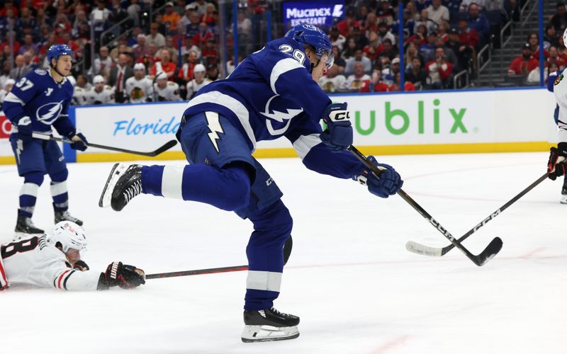 Oct 23, 2025; Tampa, Florida, USA; Tampa Bay Lightning right wing Pontus Holmberg (29) shoots against the Chicago Blackhawks during the third period at Benchmark International Arena. Mandatory Credit: Kim Klement Neitzel-Imagn Images
