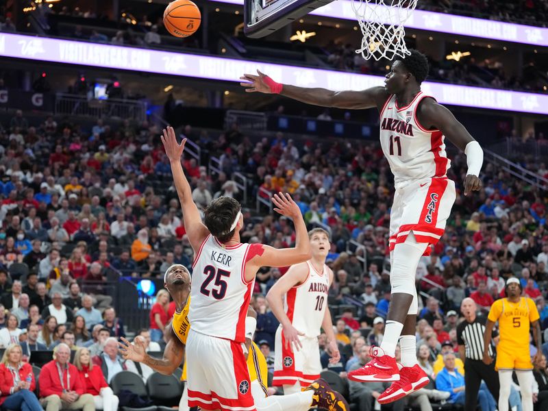 Mar 10, 2023; Las Vegas, NV, USA; Arizona Wildcats center Oumar Ballo (11) blocks a shot attempt by the Arizona State Sun Devils during the first half at T-Mobile Arena. Mandatory Credit: Stephen R. Sylvanie-USA TODAY Sports