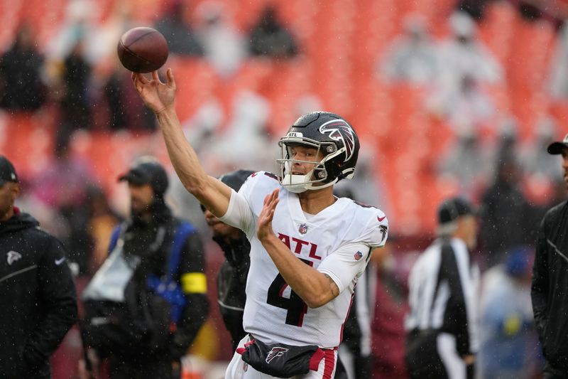 Atlanta Falcons quarterback Desmond Ridder (4) throws the ball before the start of an NFL football game against the Washington Commanders, Sunday, Nov. 27, 2022, in Landover, Md. (AP Photo/Alex Brandon)