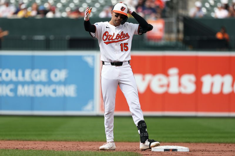 Aug 28, 2025; Baltimore, Maryland, USA; Baltimore Orioles outfielder Dylan Carlson (15) celebrates after hitting a double during the ninth inning against the Boston Red Sox at Oriole Park at Camden Yards. Mandatory Credit: Daniel Kucin Jr.-Imagn Images