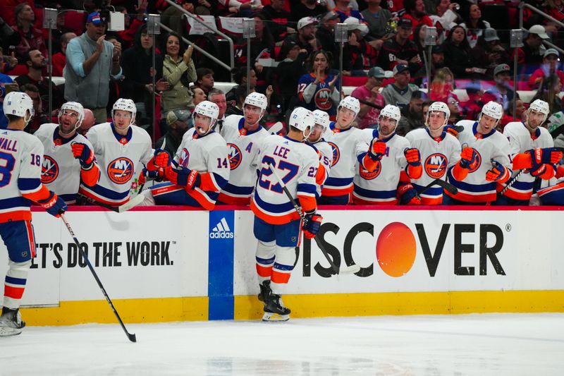 Apr 22, 2024; Raleigh, North Carolina, USA; New York Islanders left wing Anders Lee (27) celebrates his goal against the Carolina Hurricanes during the second period in game two of the first round of the 2024 Stanley Cup Playoffs at PNC Arena. Mandatory Credit: James Guillory-USA TODAY Sports