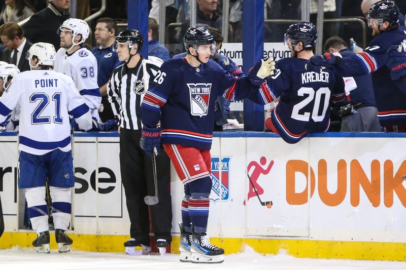 Feb 7, 2024; New York, New York, USA; New York Rangers left wing Jimmy Vesey (26) celebrates with his teammates after scoring a goal in the third period against the Tampa Bay Lightning at Madison Square Garden. Mandatory Credit: Wendell Cruz-USA TODAY Sports