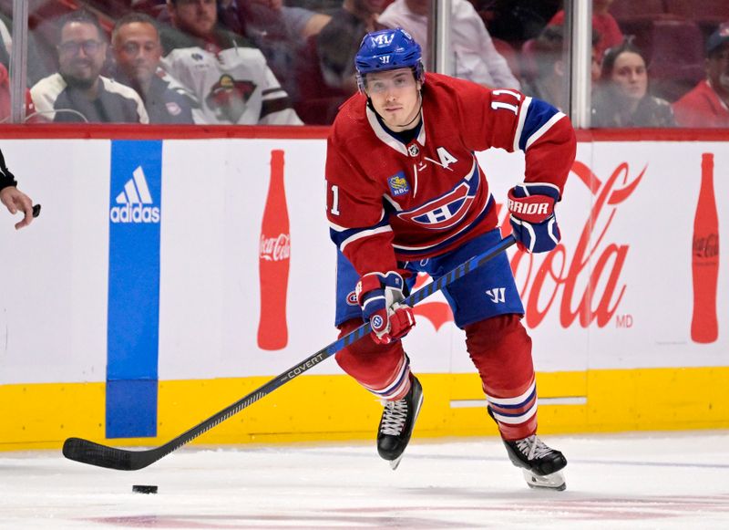 Oct 25, 2022; Montreal, Quebec, CAN; Montreal Canadiens forward Brendan Gallagher (11) plays the puck during the second period of the game against the Minnesota Wild at the Bell Centre. Mandatory Credit: Eric Bolte-USA TODAY Sports