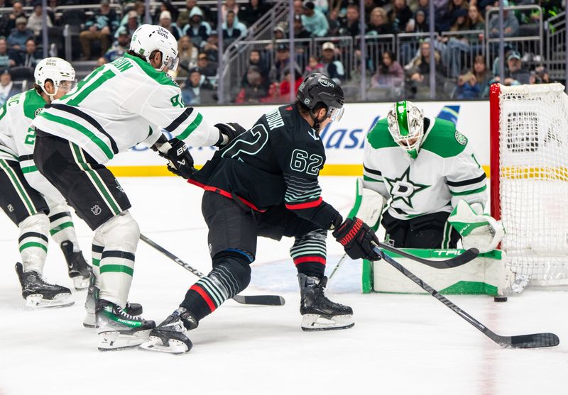 Nov 26, 2025; Seattle, Washington, USA; Seattle Kraken defenseman Brandon Montour (62) shoots the puck against Dallas Stars goalie Casey DeSmith (1) during the second period at Climate Pledge Arena. Mandatory Credit: Stephen Brashear-Imagn Images