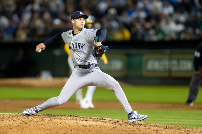 Sep 20, 2024; Oakland, California, USA; New York Yankees pitcher Luke Weaver (30) throws a pitch during the tenth inning against the Oakland Athletics at Oakland-Alameda County Coliseum. Mandatory Credit: Bob Kupbens-Imagn Images