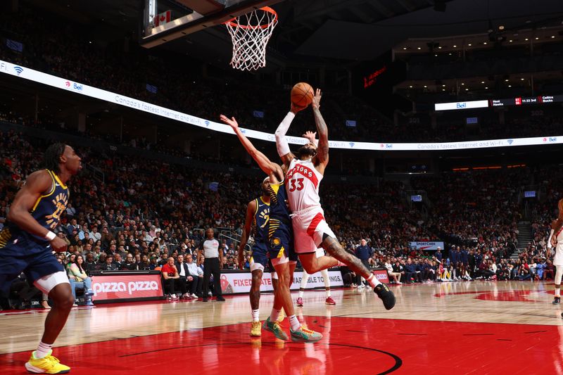 TORONTO, CANADA - APRIL 9:  Gary Trent Jr. #33 of the Toronto Raptors goes to the basket during the game on April 9, 2024 at the Scotiabank Arena in Toronto, Ontario, Canada.  NOTE TO USER: User expressly acknowledges and agrees that, by downloading and or using this Photograph, user is consenting to the terms and conditions of the Getty Images License Agreement.  Mandatory Copyright Notice: Copyright 2024 NBAE (Photo by Vaughn Ridley/NBAE via Getty Images)