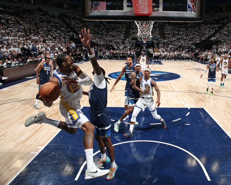 MINNEAPOLIS, MN -  MAY 8: Jonathan Kuminga #00 of the Golden State Warriors looks to pass the ball during the game against the Minnesota Timberwolves during Round 2 Game 2 of the 2025 NBA Playoffs on May 8, 2025 at Target Center in Minneapolis, Minnesota. NOTE TO USER: User expressly acknowledges and agrees that, by downloading and or using this Photograph, user is consenting to the terms and conditions of the Getty Images License Agreement. Mandatory Copyright Notice: Copyright 2025 NBAE(Photo by David Sherman/NBAE via Getty Images)