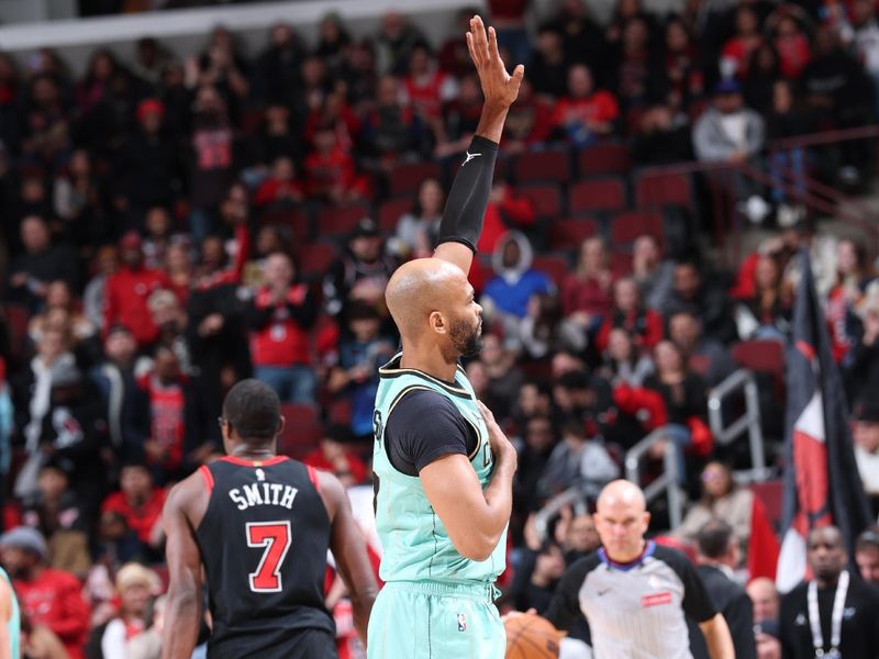 CHICAGO, IL - DECEMBER 13: Taj Gibson #67 of the Charlotte Hornets waves to the crowd  during the game against the Chicago Bulls  on December 13, 2024 at United Center in Chicago, Illinois. NOTE TO USER: User expressly acknowledges and agrees that, by downloading and or using this photograph, User is consenting to the terms and conditions of the Getty Images License Agreement. Mandatory Copyright Notice: Copyright 2024 NBAE (Photo by Jeff Haynes/NBAE via Getty Images)