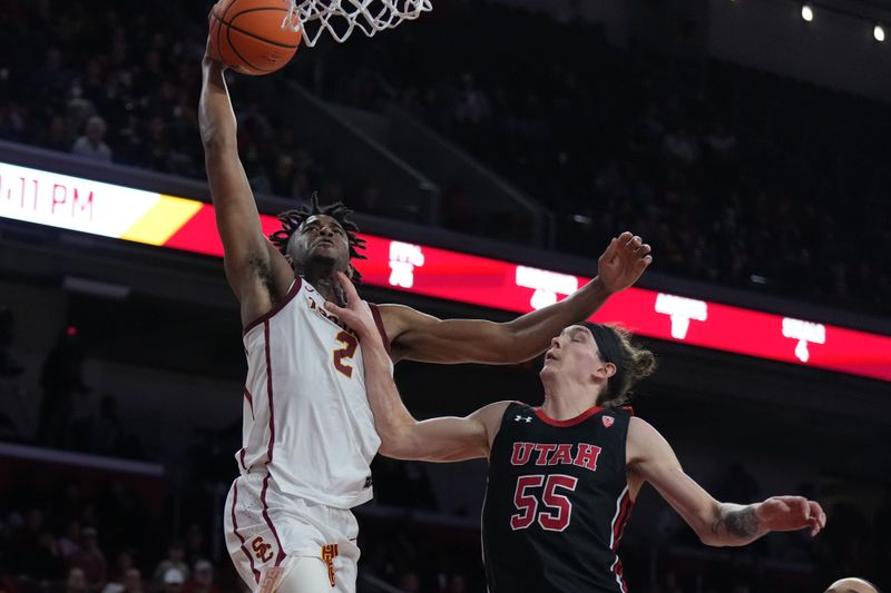 January 14, 2023; Los Angeles, California, USA; Southern California Trojans guard Reese Dixon-Waters (2) shoots the ball against Utah Utes guard Gabe Madsen (55) in the second half at Galen Center. Mandatory Credit: Kirby Lee-USA TODAY Sports