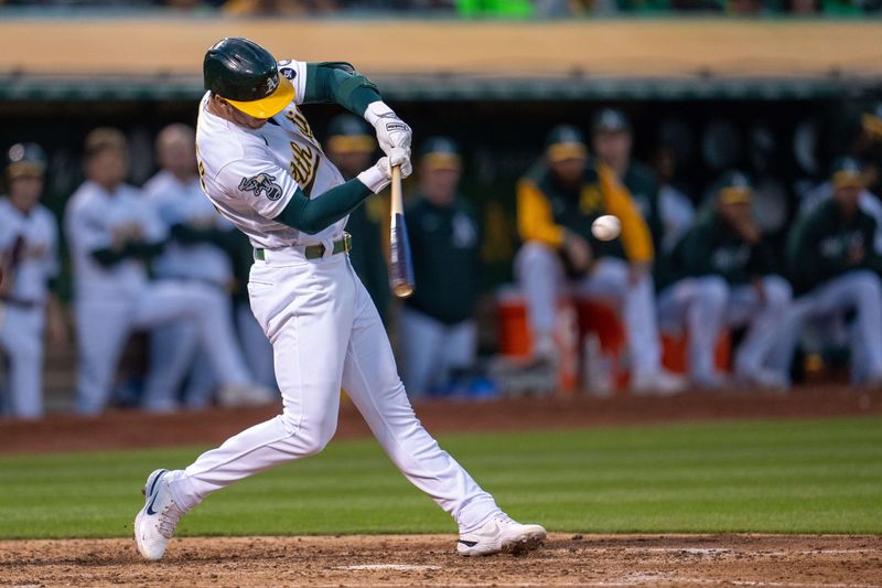 Jun 13, 2023; Oakland, California, USA; Oakland Athletics designated hitter Brent Rooker (25) hits a RBI double against the Tampa Bay Rays during the seventh inning at Oakland-Alameda County Coliseum. Mandatory Credit: Neville E. Guard-USA TODAY Sports