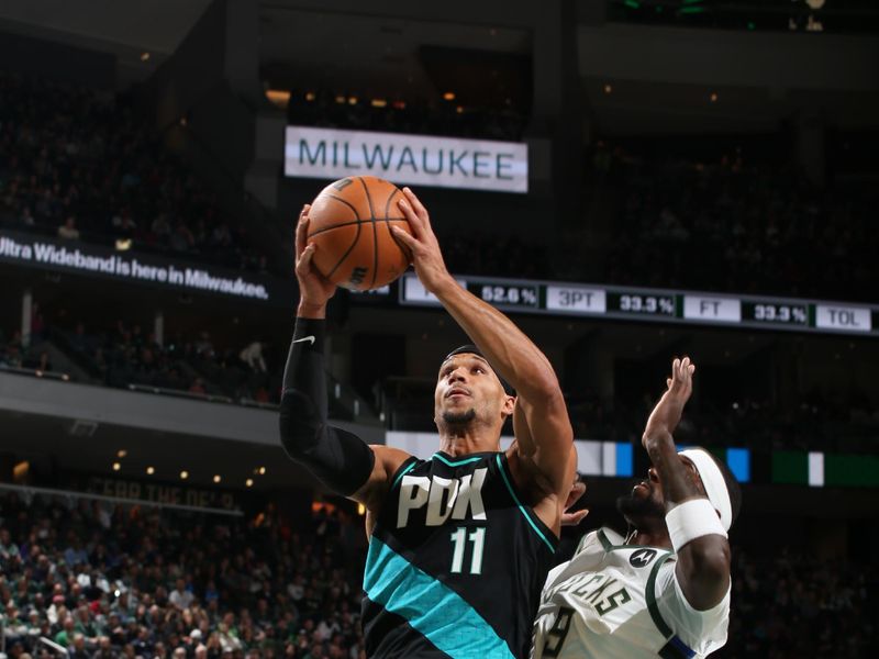 MILWAUKEE, WI - NOVEMBER 21: Josh Hart #11 of the Portland Trail Blazers drives to the basket during the game against the Milwaukee Bucks on November 21, 2022 at the Fiserv Forum Center in Milwaukee, Wisconsin. NOTE TO USER: User expressly acknowledges and agrees that, by downloading and or using this Photograph, user is consenting to the terms and conditions of the Getty Images License Agreement. Mandatory Copyright Notice: Copyright 2022 NBAE (Photo by Gary Dineen/NBAE via Getty Images).