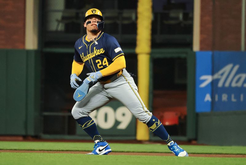 Sep 12, 2024; San Francisco, California, USA; Milwaukee Brewers catcher William Contreras (24) follows the ball against the San Francisco Giants during the fourth inning at Oracle Park. Mandatory Credit: Kelley L Cox-Imagn Images