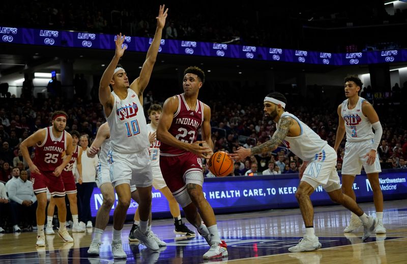 Feb 15, 2023; Evanston, Illinois, USA; Northwestern Wildcats forward Tydus Verhoeven (10) as guard Boo Buie (0) steals the ball from Indiana Hoosiers forward Trayce Jackson-Davis (23) during the first half at Welsh-Ryan Arena. Mandatory Credit: David Banks-USA TODAY Sports