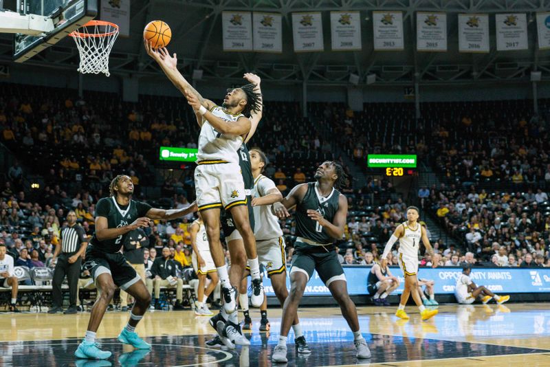 Mar 2, 2024; Wichita, Kansas, USA; Wichita State Shockers guard Colby Rogers (4) shoots the ball during the first half against the Rice Owls at Charles Koch Arena. Mandatory Credit: William Purnell-USA TODAY Sports