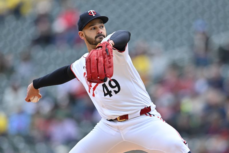 May 4, 2024; Minneapolis, Minnesota, USA; Minnesota Twins pitcher Pablo López (49) throws a pitch against the Minnesota Twins during the first inning at Target Field. Mandatory Credit: Jeffrey Becker-USA TODAY Sports