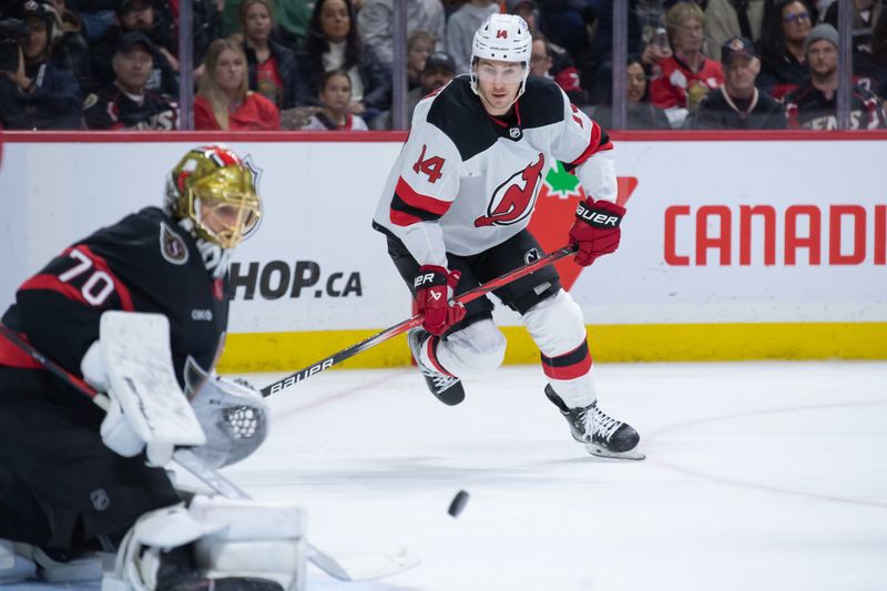 Dec 29, 2023; Ottawa, Ontario, CAN; New Jersey Devils right wing Nathan Bastian (14) follows the puck on a rebound from Ottawa Senatorsgoalie Joonas Korpisalo (70) in the second period at the Canadian Tire Centre. Mandatory Credit: Marc DesRosiers-USA TODAY Sports