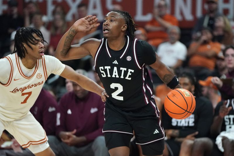 Jan 3, 2026; Austin, Texas, USA; Mississippi State Bulldogs guard Ja’borri Mcghee (2) dribbles defended by Texas Longhorns guard Simeon Wilcher (7) during the first half at Moody Center. Mandatory Credit: Dustin Safranek-Imagn Images