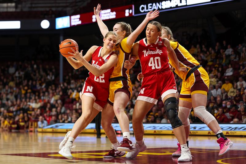 Jan 14, 2024; Minneapolis, Minnesota, USA; Nebraska Cornhuskers forward Natalie Potts (22) works towards the basket as Minnesota Golden Gophers forward Mallory Heyer (24) defends during the second half at Williams Arena. Mandatory Credit: Matt Krohn-USA TODAY Sports