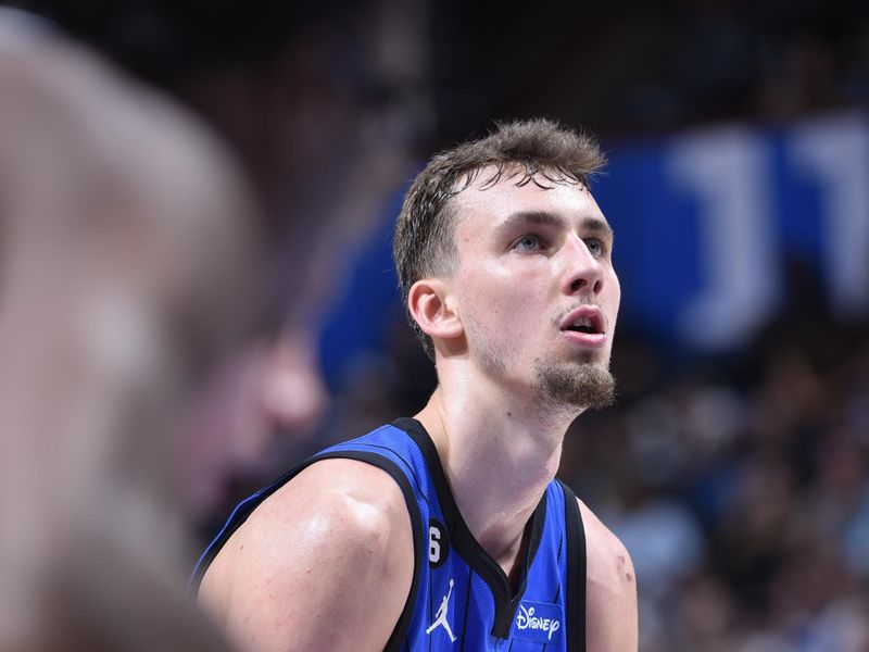 ORLANDO, FL - FEBUARY 25: Franz Wagner #22 of the Orlando Magic shoots a free throw during the game on Febuary 25, 2023 at Amway Center in Orlando, Florida. NOTE TO USER: User expressly acknowledges and agrees that, by downloading and or using this photograph, User is consenting to the terms and conditions of the Getty Images License Agreement. Mandatory Copyright Notice: Copyright 2023 NBAE (Photo by Gary Bassing/NBAE via Getty Images)