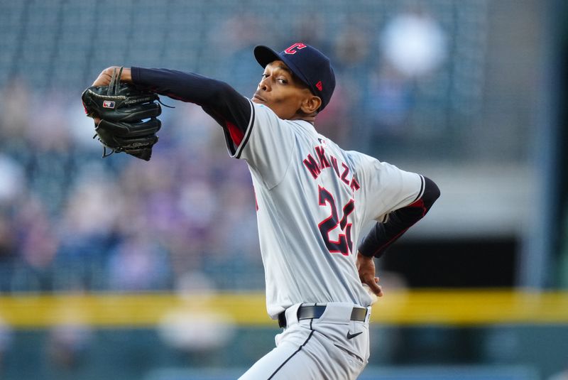 May 28, 2024; Denver, Colorado, USA; Cleveland Guardians starting pitcher Triston McKenzie (24) delivers a pitch in the first inning against the Colorado Rockies at Coors Field. Mandatory Credit: Ron Chenoy-USA TODAY Sports