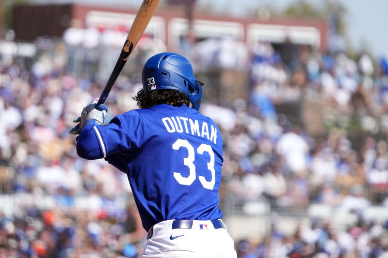 Mar 1, 2025; Phoenix, Arizona, USA; Los Angeles Dodgers outfielder James Outman (33) bat against the San Francisco Giants during the second inning at Camelback Ranch-Glendale. Mandatory Credit: Joe Camporeale-Imagn Images