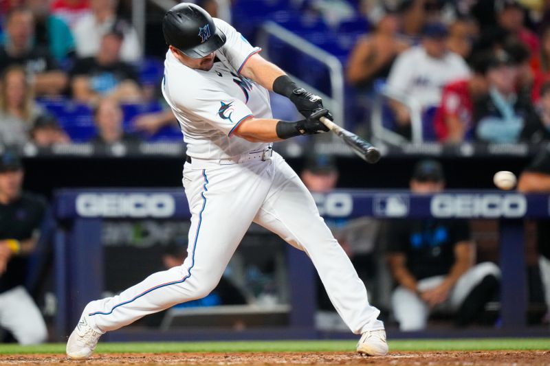 Sep 17, 2023; Miami, Florida, USA; Miami Marlins third baseman Jake Burger (36) hits a double against the Atlanta Braves during the sixth inning at loanDepot Park. Mandatory Credit: Rich Storry-USA TODAY Sports