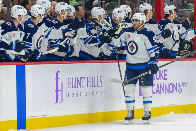 Nov 25, 2024; Saint Paul, Minnesota, USA;  Winnipeg Jets forward Alex Iafallo (9) celebrates his goal against the Minnesota Wild during the first period at Xcel Energy Center. Mandatory Credit: Nick Wosika-Imagn Images