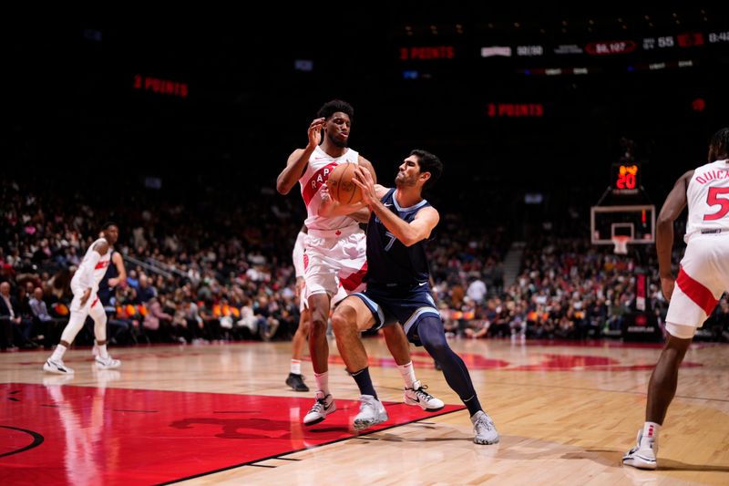 TORONTO, CANADA - JANUARY 22: Santi Aldama #7 of the Memphis Grizzlies handles the ball during the game against the Toronto Raptors on January 22, 2024 at the Scotiabank Arena in Toronto, Ontario, Canada.  NOTE TO USER: User expressly acknowledges and agrees that, by downloading and or using this Photograph, user is consenting to the terms and conditions of the Getty Images License Agreement.  Mandatory Copyright Notice: Copyright 2024 NBAE (Photo by Mark Blinch/NBAE via Getty Images)