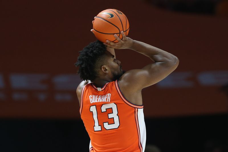 Dec 9, 2023; Knoxville, Tennessee, USA; Illinois Fighting Illini forward Quincy Guerrier (13) shoots a three point basket against the Tennessee Volunteers during the first half at Food City Center at Thompson-Boling Arena. Mandatory Credit: Randy Sartin-USA TODAY Sports