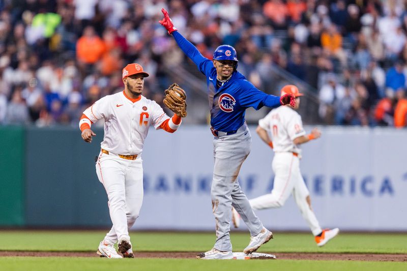 Jun 25, 2024; San Francisco, California, USA; Chicago Cubs third baseman Christopher Morel (5) reacts after being tagged by San Francisco Giants second baseman Thairo Estrada (39) during the sixth inning at Oracle Park. Mandatory Credit: John Hefti-USA TODAY Sports