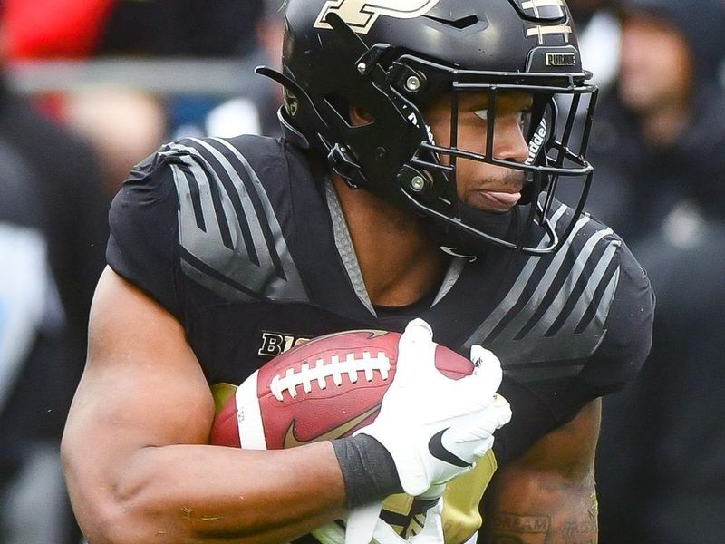 Oct 14, 2023; West Lafayette, Indiana, USA;  Purdue Boilermakers running back Dylan Downing (22) runs the ball during the second half at Ross-Ade Stadium. Mandatory Credit: Robert Goddin-USA TODAY Sports