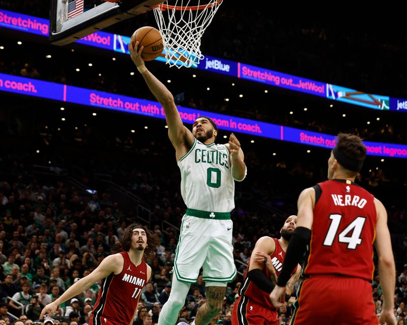 BOSTON, MA - APRIL 21: Jayson Tatum #0 of the Boston Celtics goes to the basket as the Miami Heat defense looks on during the second half of game one of the Eastern Conference First Round Playoffs at TD Garden on April 21, 2024 in Boston, Massachusetts. NOTE TO USER: User expressly acknowledges and agrees that, by downloading and/or using this Photograph, user is consenting to the terms and conditions of the Getty Images License Agreement. (Photo By Winslow Townson/Getty Images)