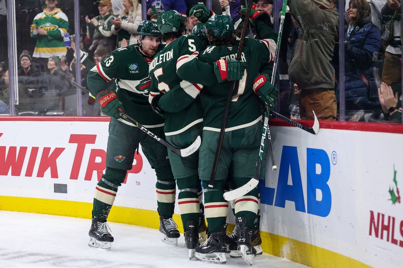 Dec 3, 2024; Saint Paul, Minnesota, USA; Minnesota Wild center Frederick Gaudreau (89) celebrates his goal with teammates during the second period against the Vancouver Canucks at Xcel Energy Center. Mandatory Credit: Matt Krohn-Imagn Images